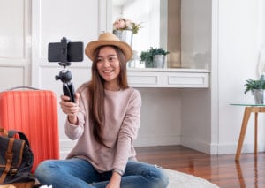 Female vloger recording