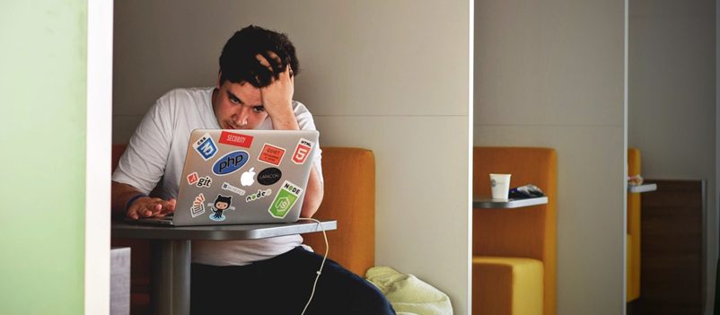 Man on laptop frustrated at bounce rate