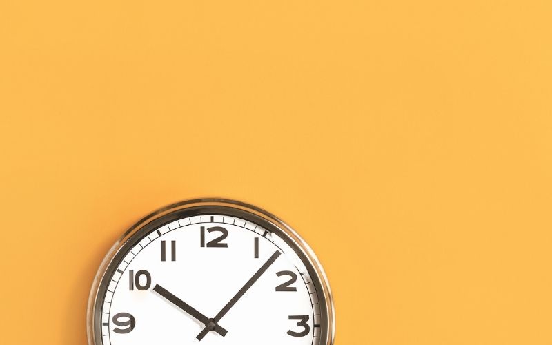 clock on orange background